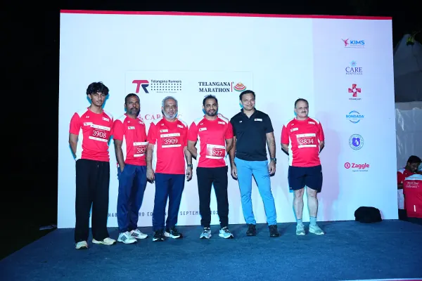 Organisers and guests lined up on stage