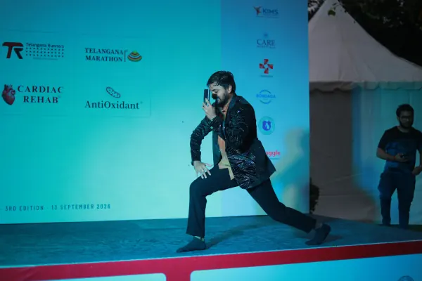 Performer on stage leading the crowd