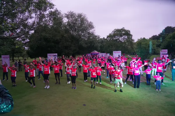 Wide view: full field warm-up from behind the lights