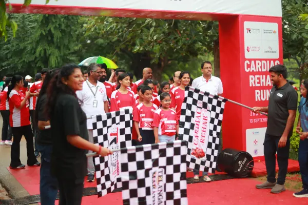 Flags crossed in front of children at the line