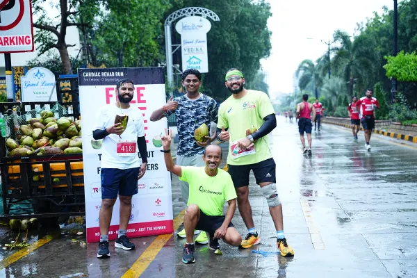 Runners posing with tender coconuts at the stall