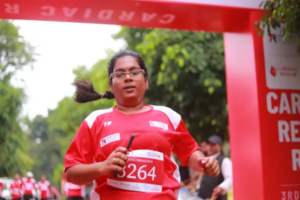 Woman sprinting in, hair flying