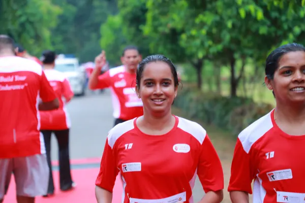 Two women smiling at the finish