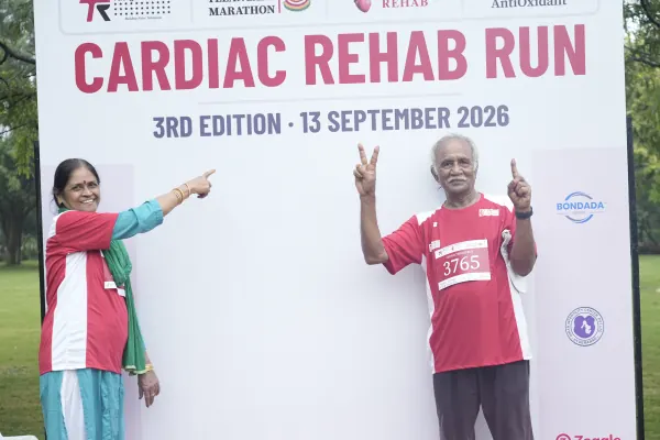 Older couple pointing and cheering