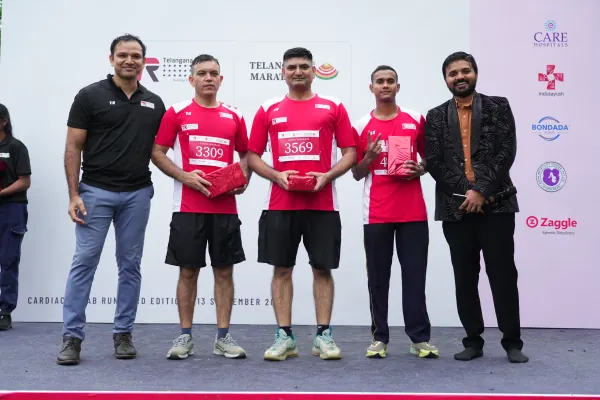 Winners on the stage holding prizes