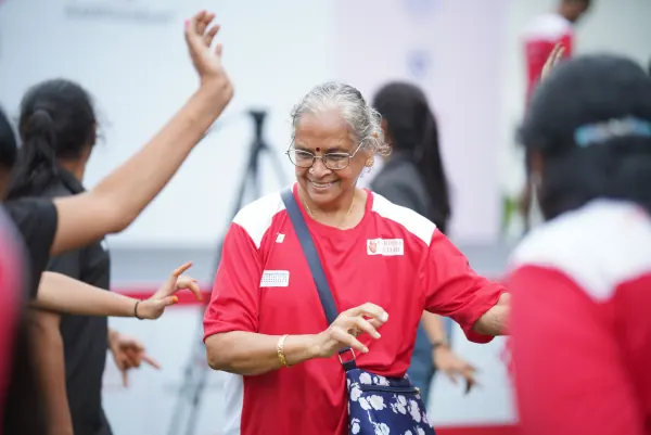 Older woman dancing, big smile